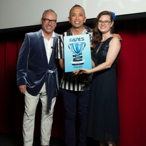 Albert Lao accepting a Favies award from Faces of Pensacola