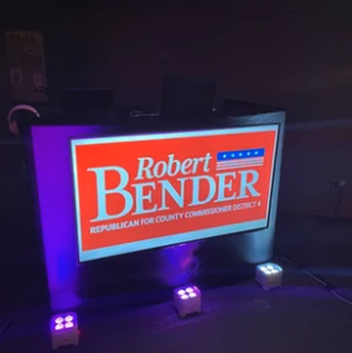 Lit DJ facade branded for a campaign event