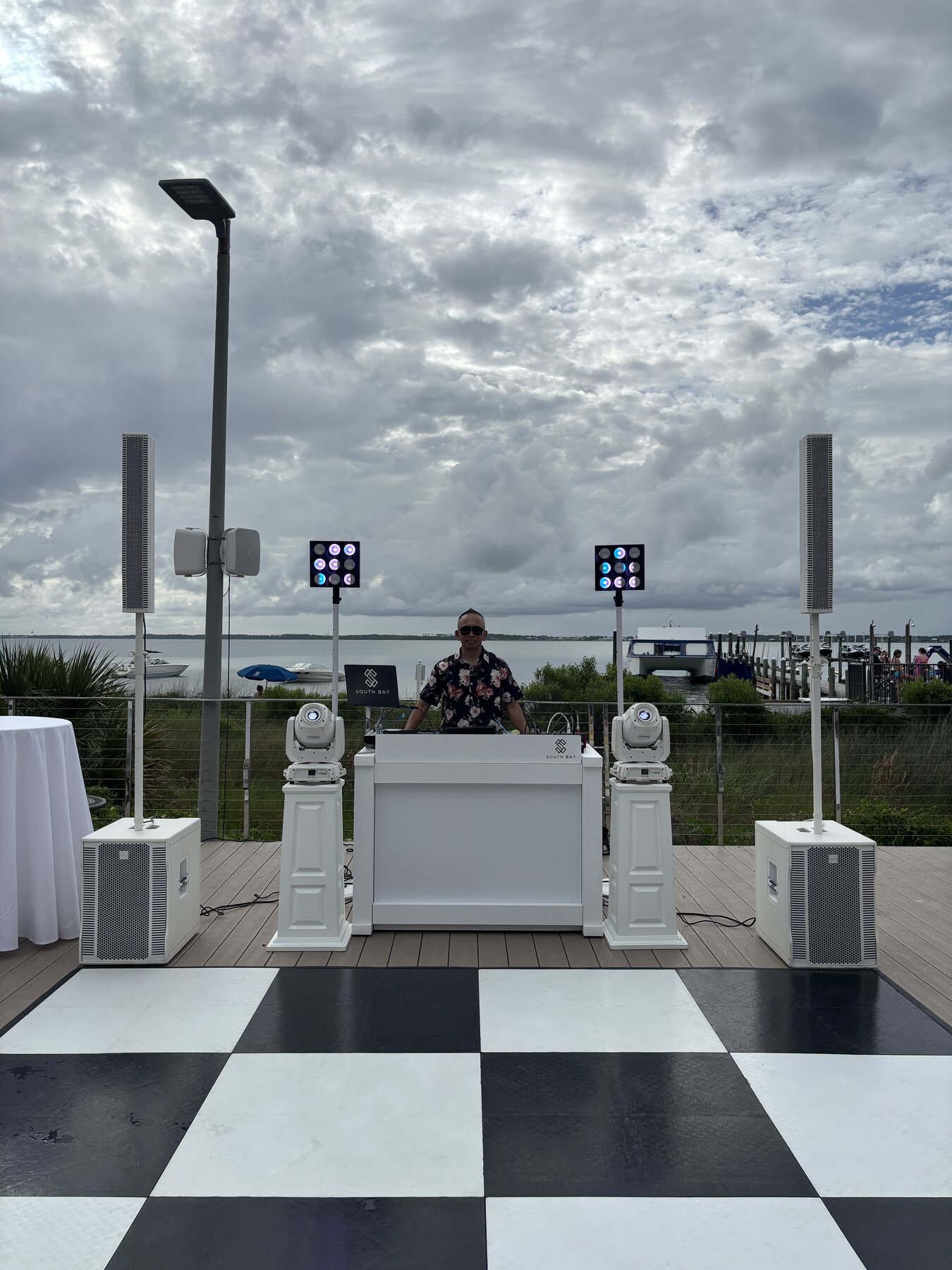 All-white waterfront deck setup at Portofino